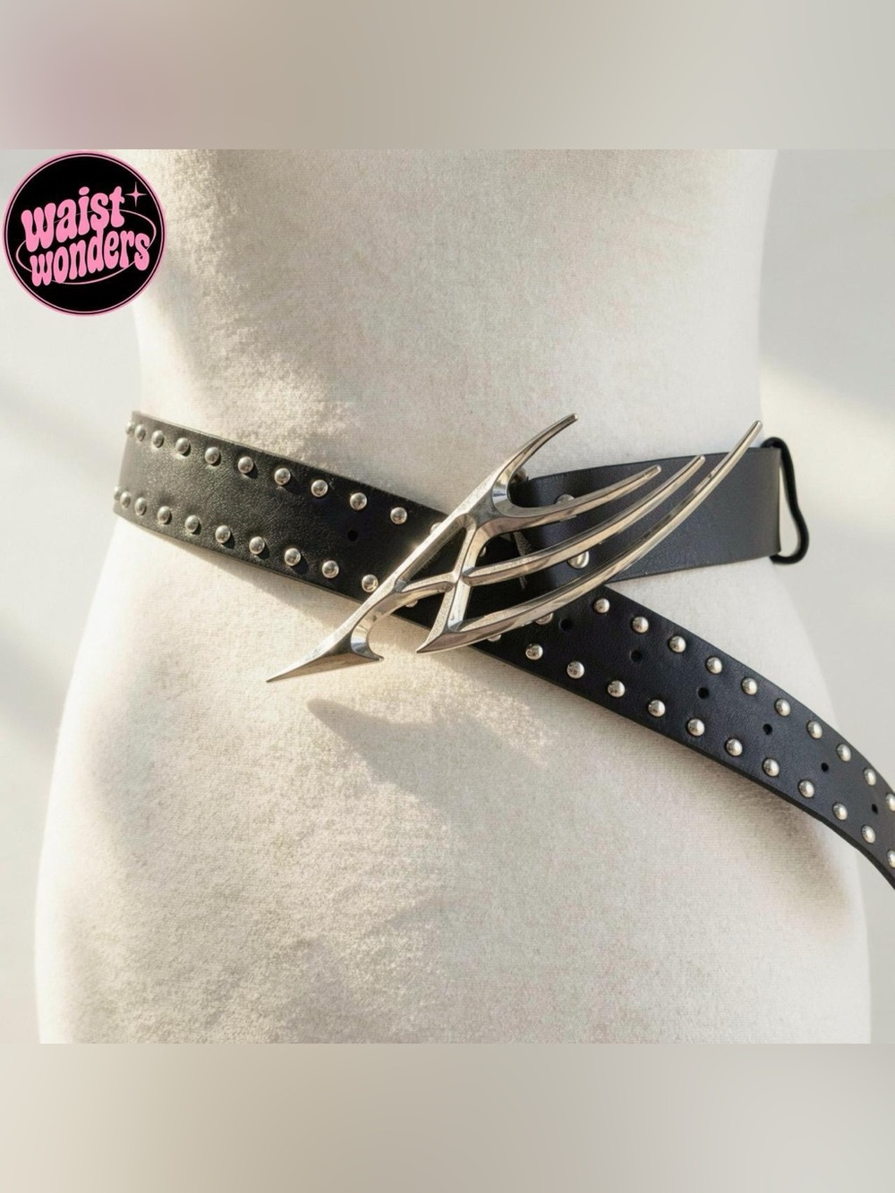 Y2K 2000s style Black leather studded belt with silver metal wings buckle